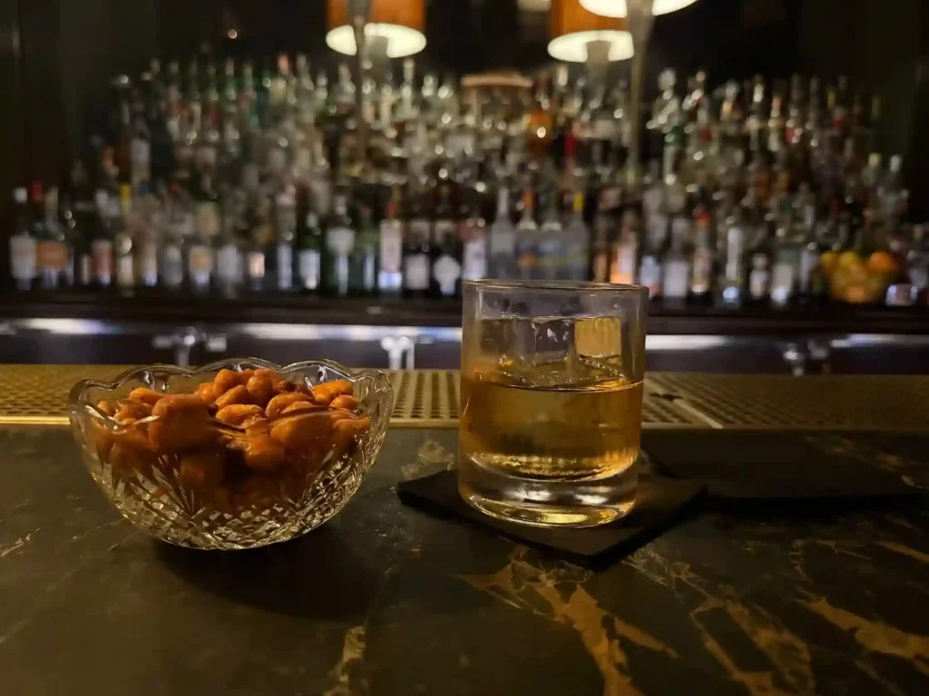 Having a scotch on the rocks at The Little Ned lounge.