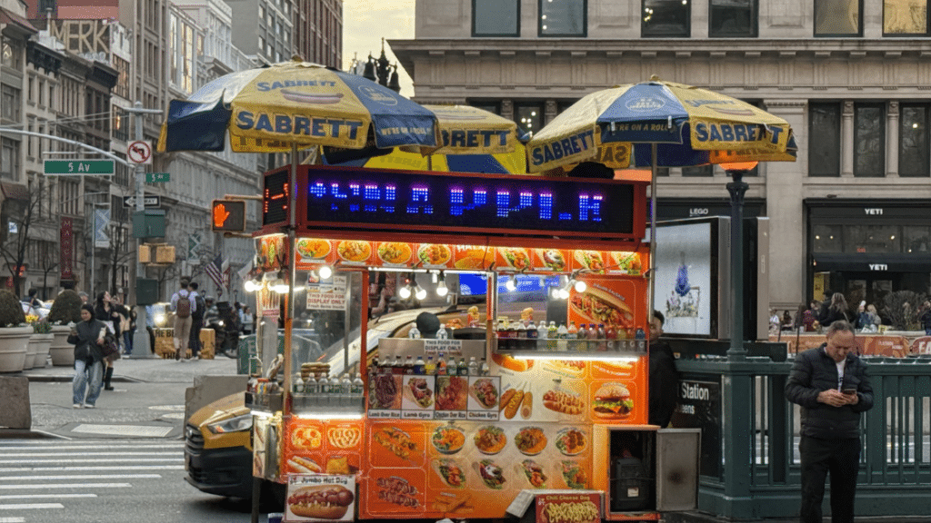 Photo of a food truck in the Flatiron District near to this great condo building called Chelsea Stratus Condominium.