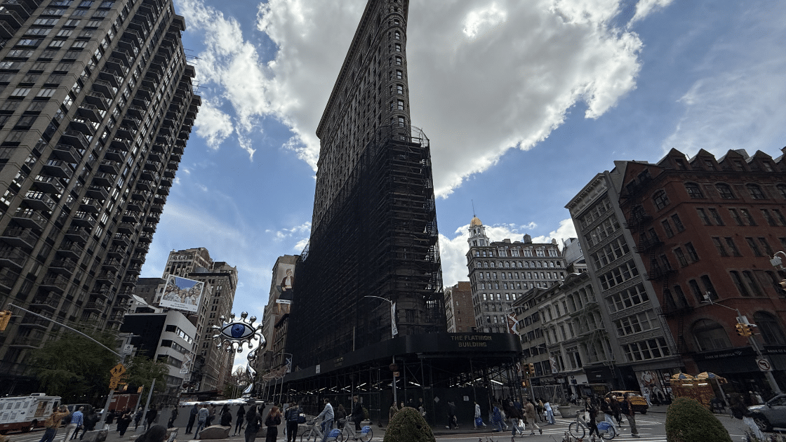 Flatiron Building under construction, urban scene where the architect Napoleon LeBrun helped shape this area.